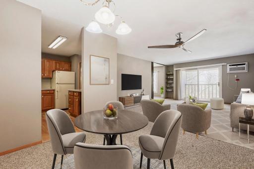 Virtually staged dining room and living room, including ceiling fan.