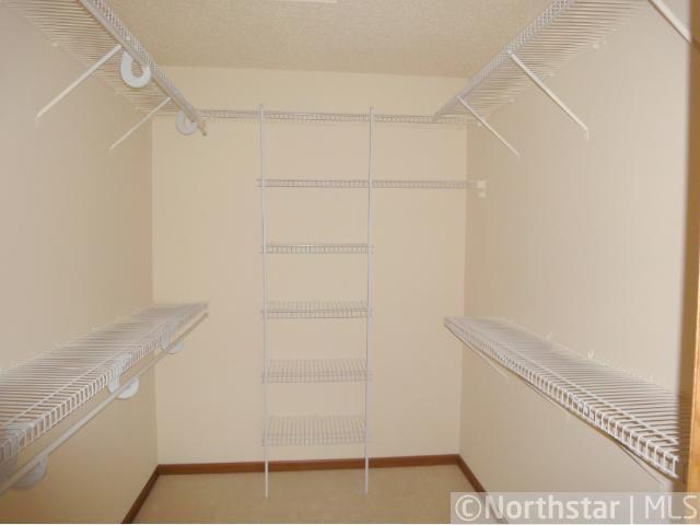 14 - Primary BR Walk in Closet.jpg