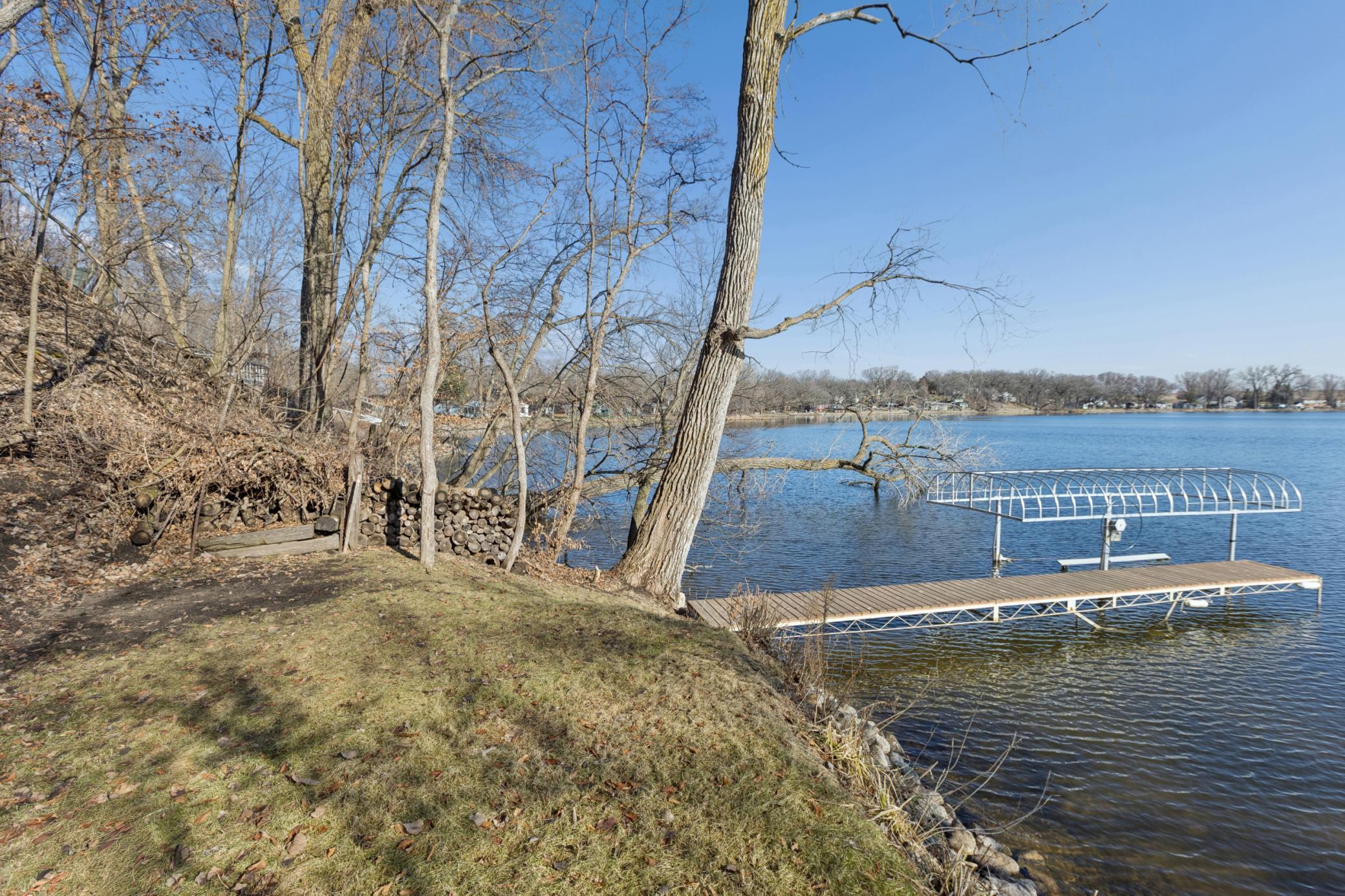 With 124 feet of private shoreline, you'll enjoy expansive water views and a peaceful, serene setting.