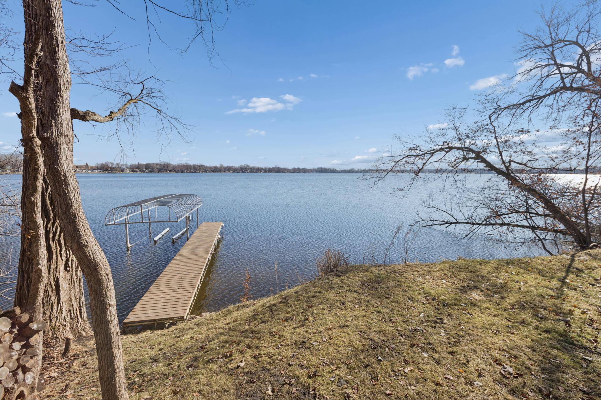 With 124 feet of private shoreline, you'll enjoy expansive water views and a peaceful, serene setting.