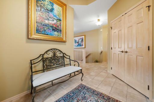 Entry features ceramic tile flooring w/ coat closet