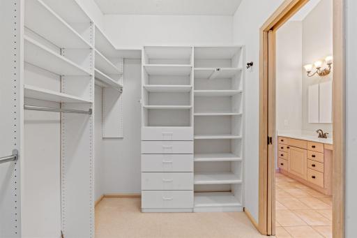 Spacious walk-in closet w/ professionally installed organizer and pocket door access