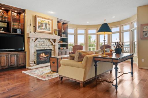 Living Room features gas fireplace w/ cultured stone surround and custom reclaimed wooden mantel