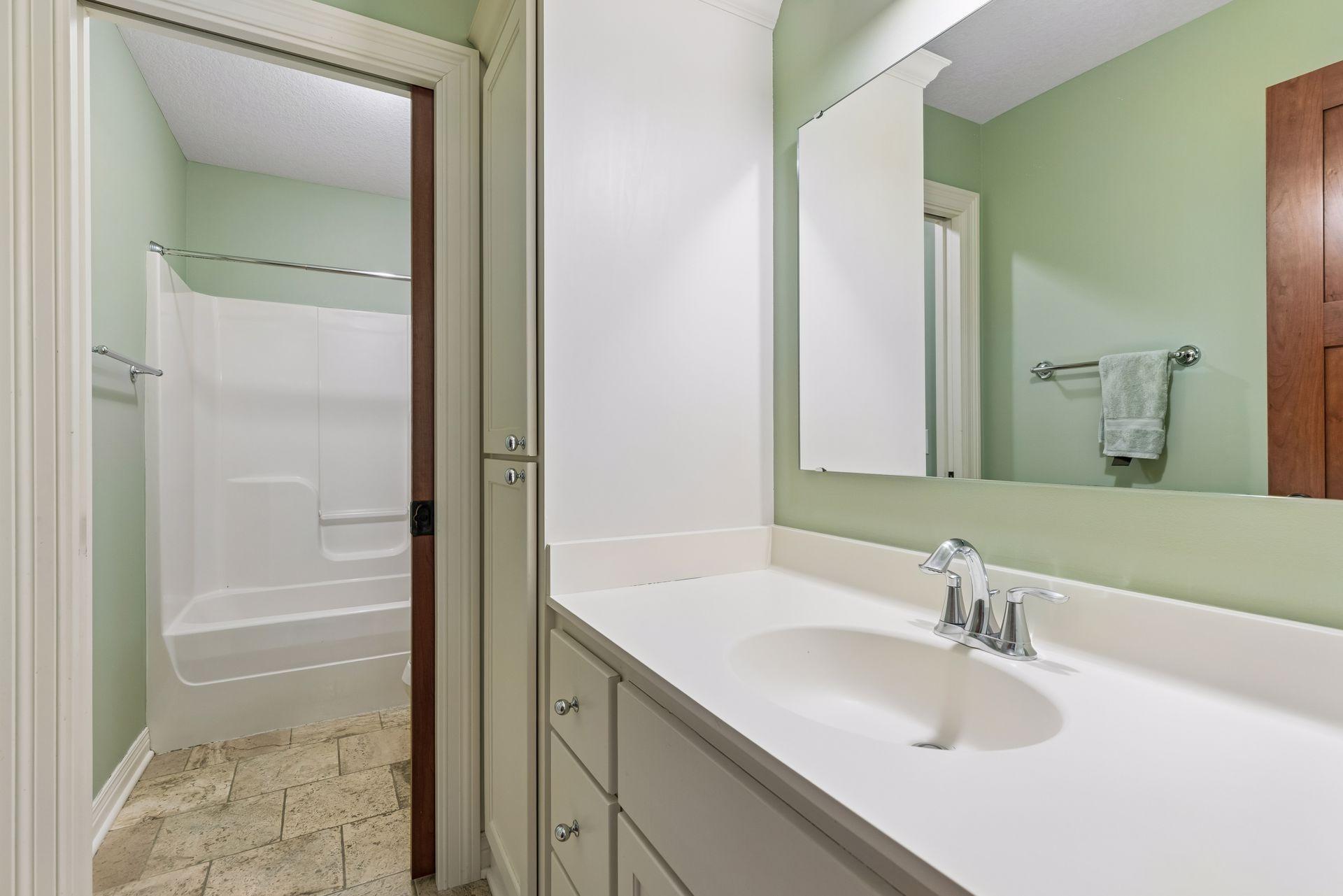 Additional full bathroom serving the upper-level secondary bedrooms.