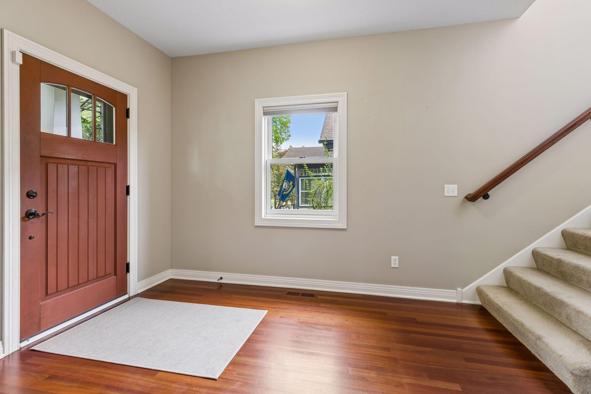 Consistent cherry hardwood floors on the main level.