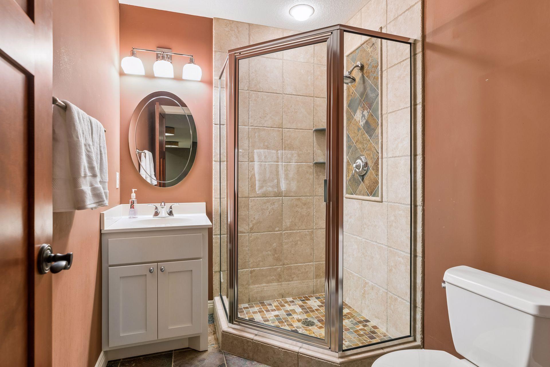 The lower level guest bathroom complete with shower.