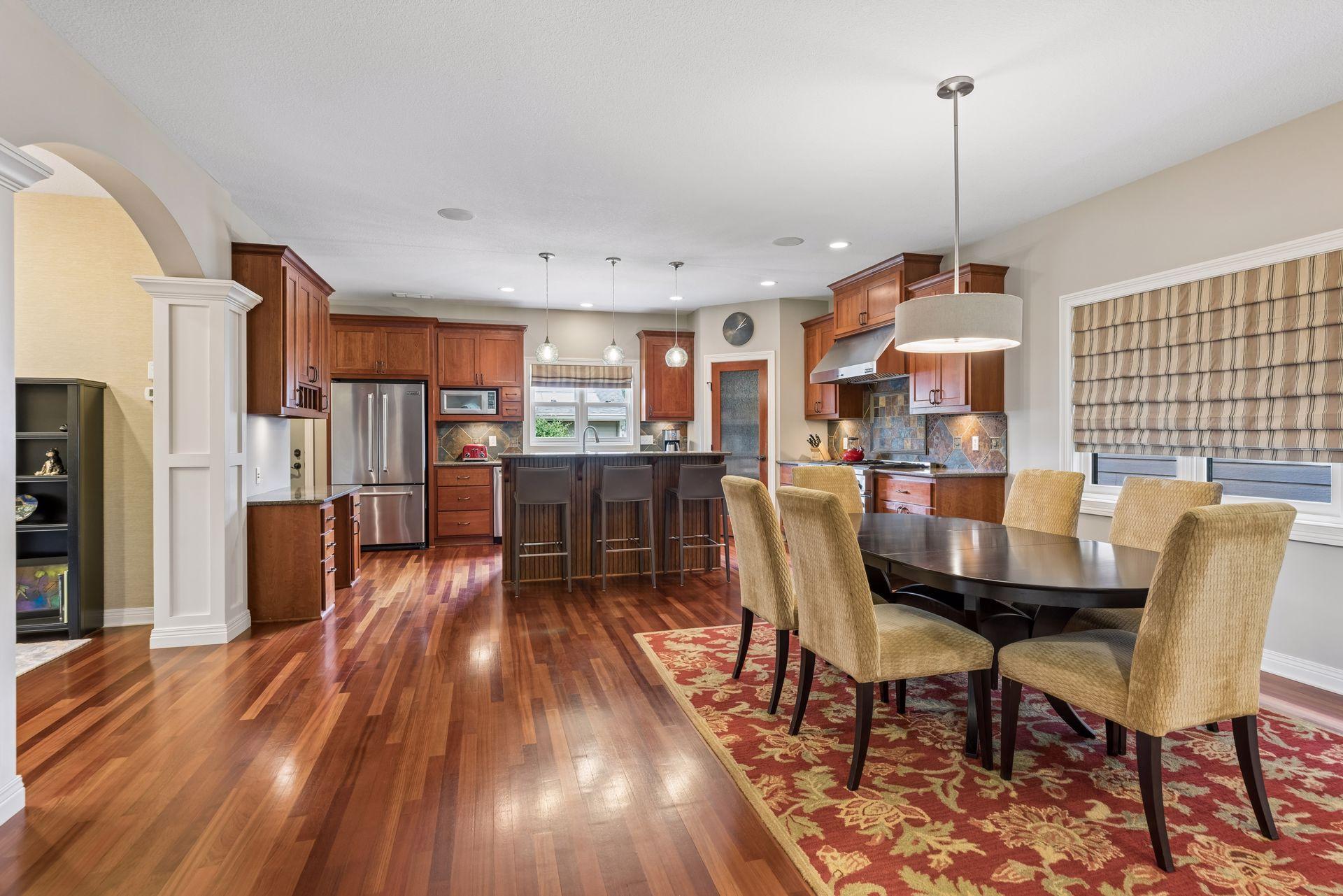 Cherry hardwood floors throughout the kitchen and dining areas.