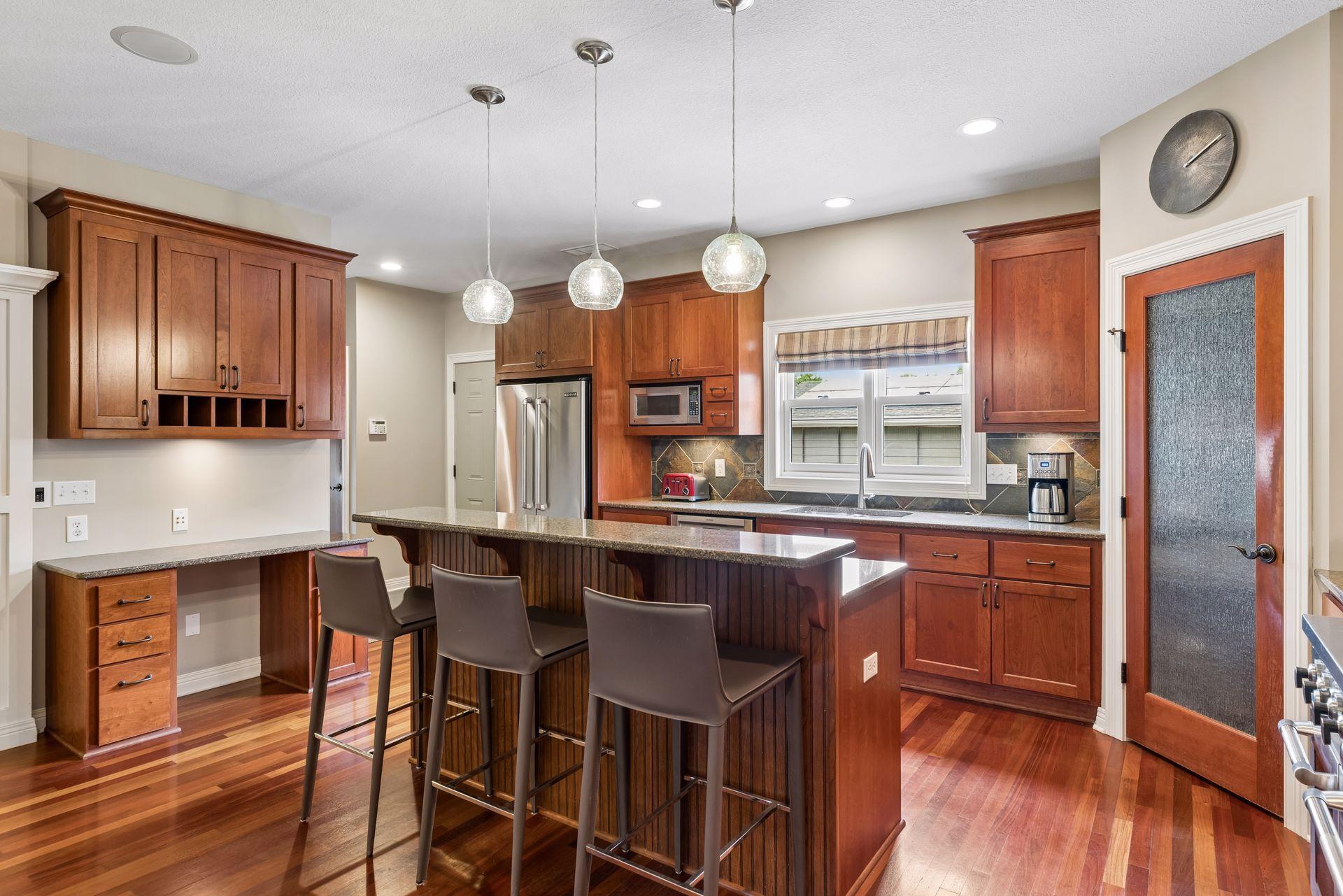 Granite countertops and a cookbook/laptop recipe workstation.