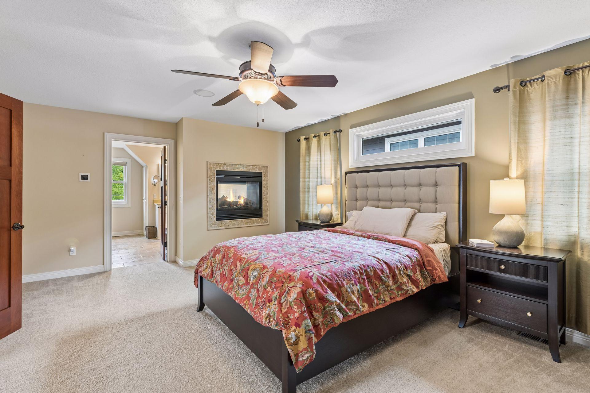 Entrance to the spacious primary suite through the cherry French doors.