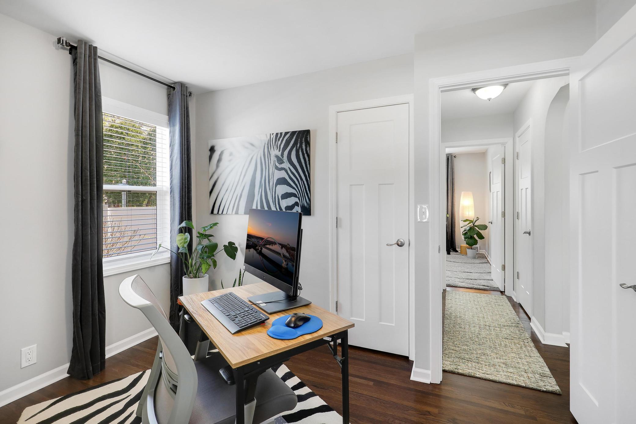 Main floor bedroom currently used as an office. All new paneled doors and trim give it that polished look!