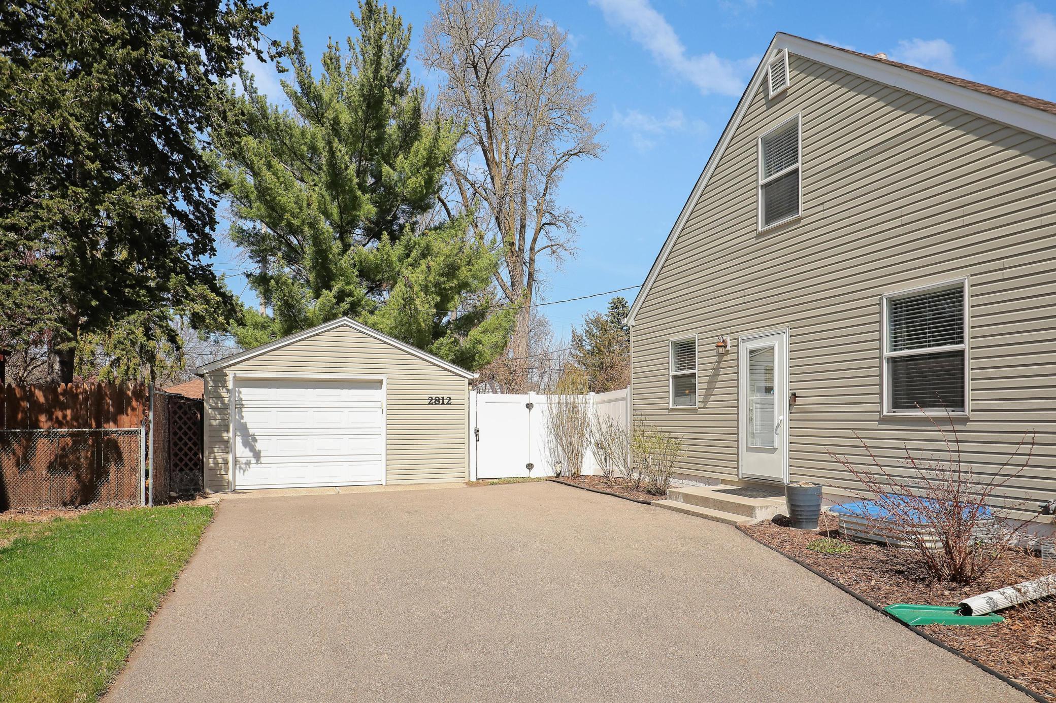 Flat south facing driveway with an oversized garage. Please find the survey the current owner had done with thoughts of potentially adding a two car garage in the future.