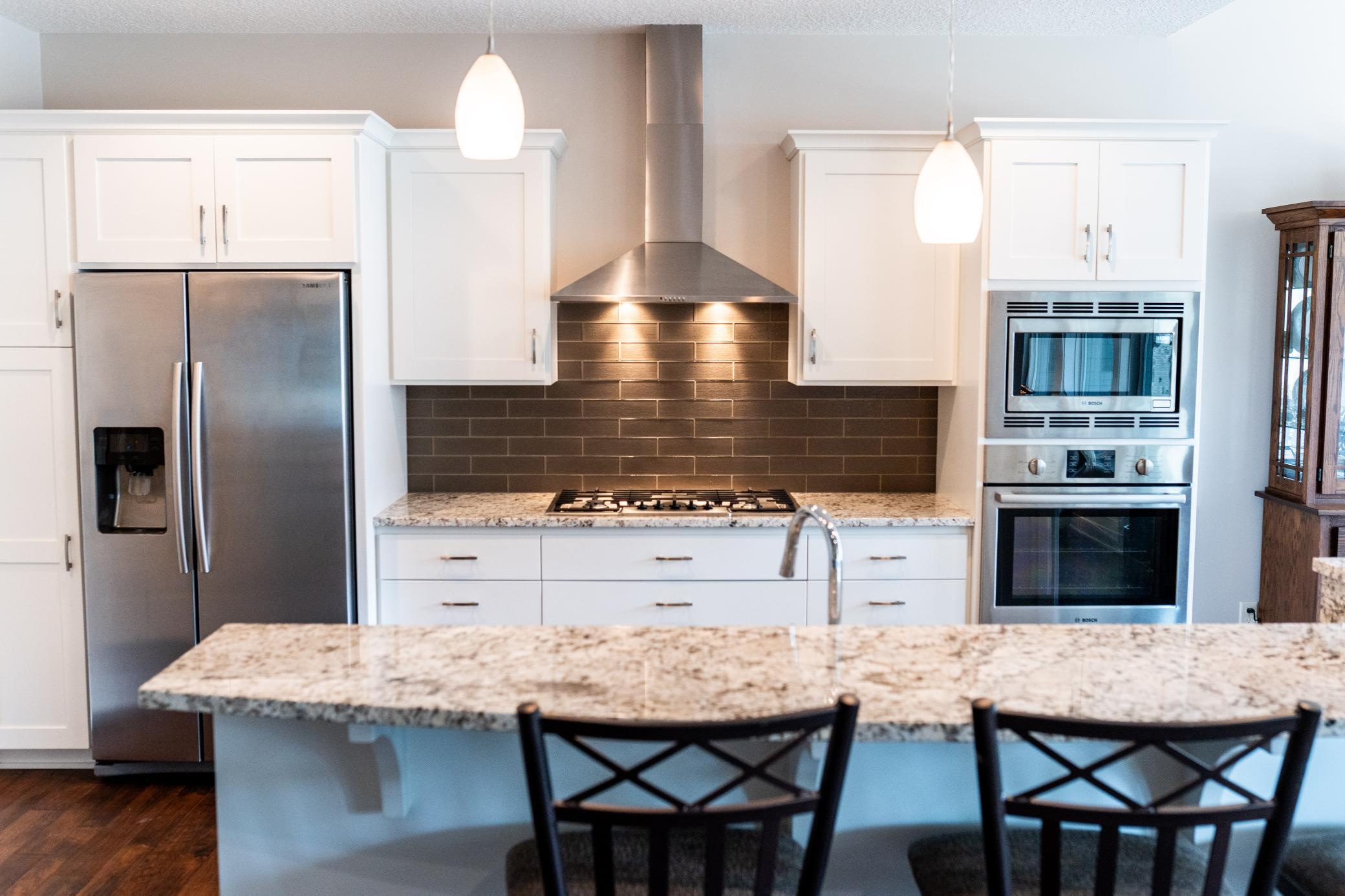 Granite Countertops with Stone Backsplash