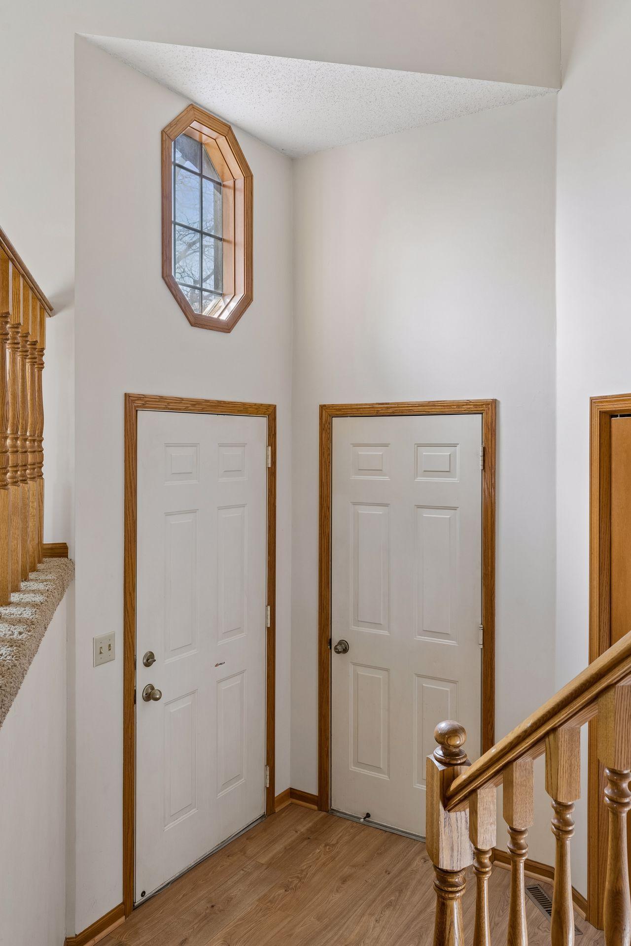 Foyer features decorative transom window, letting in additional sunlight!
