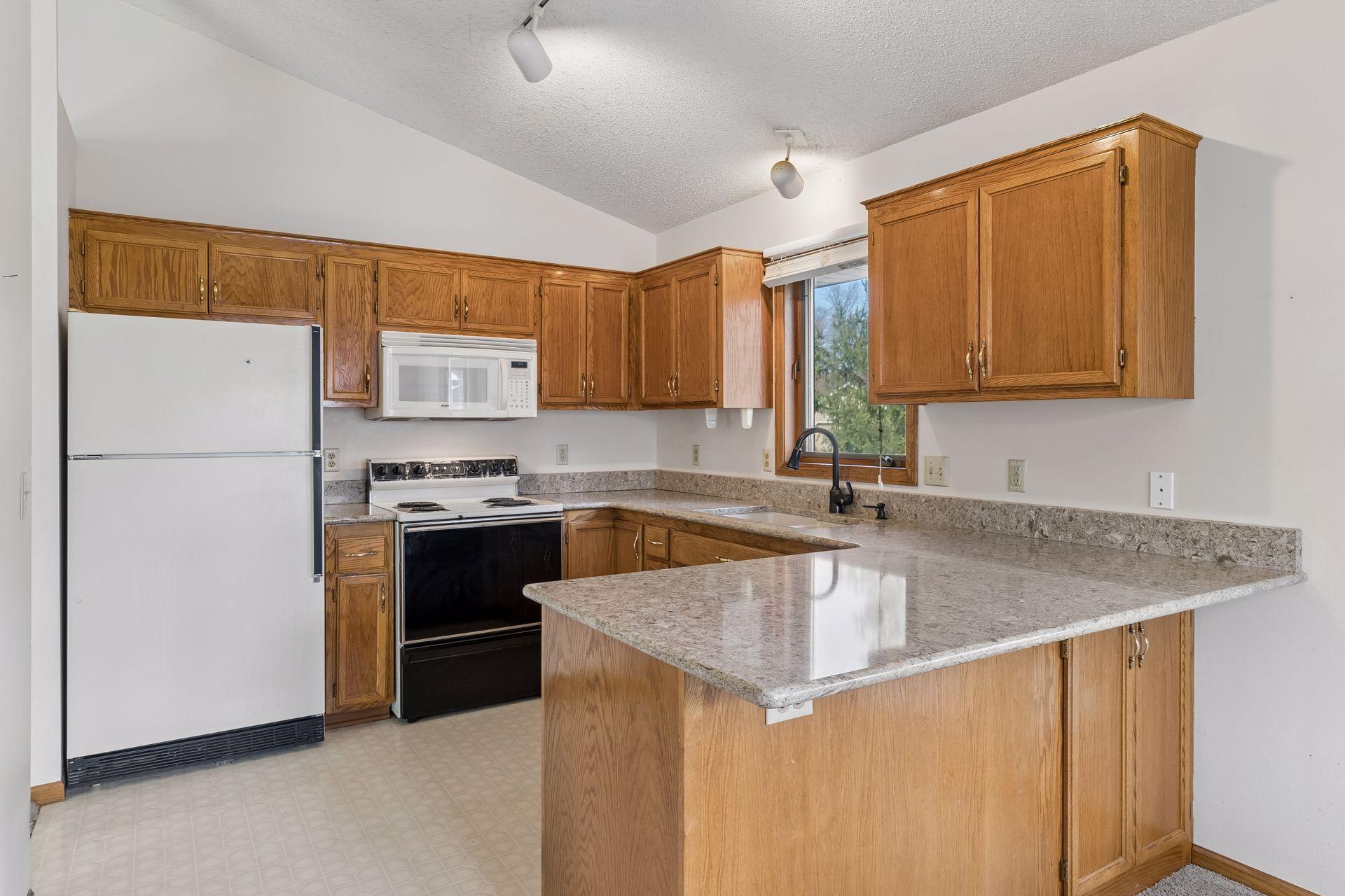 Nice Cambria countertops give you lots of space to prepare meals