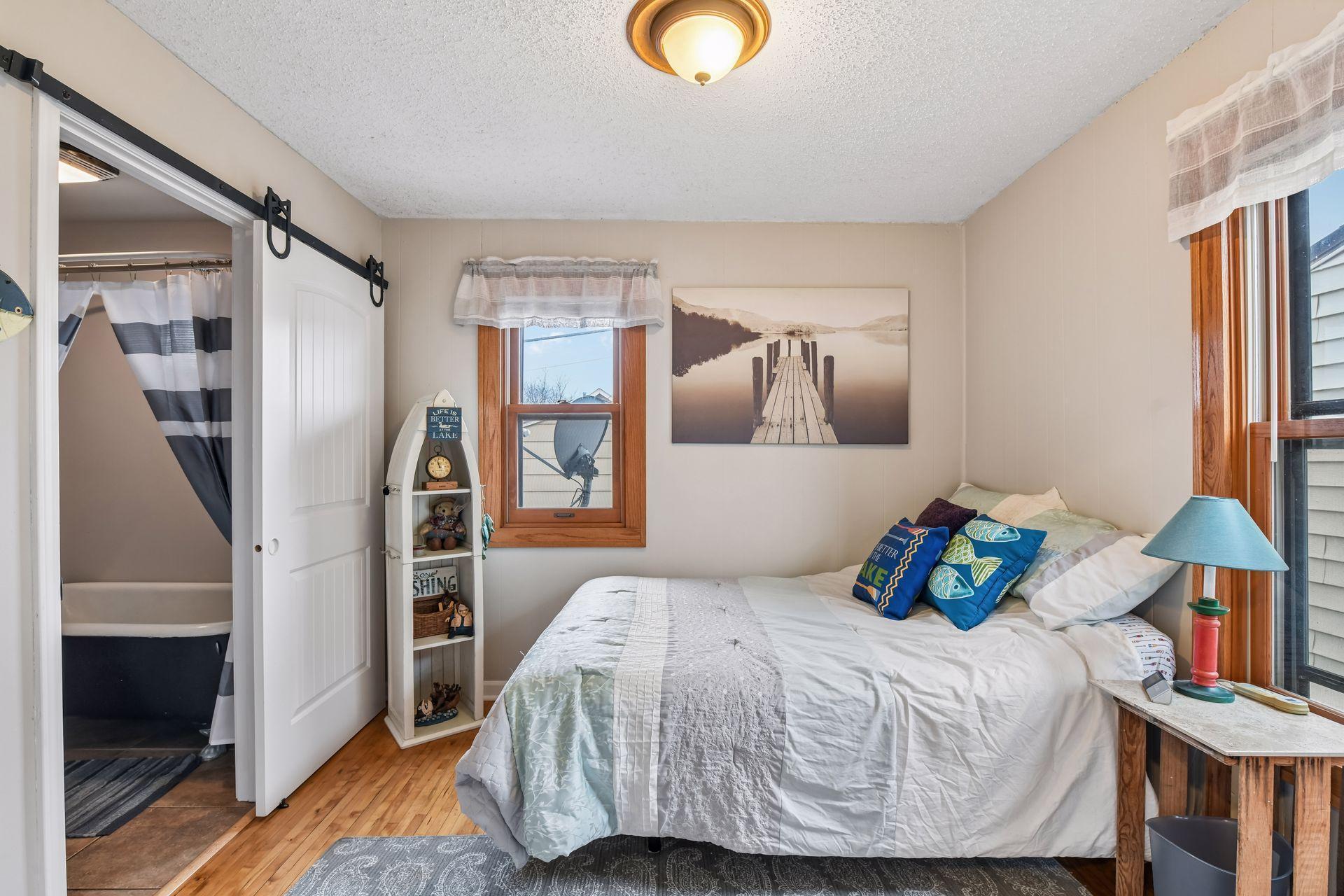 Main floor bedroom with attached full bath.
