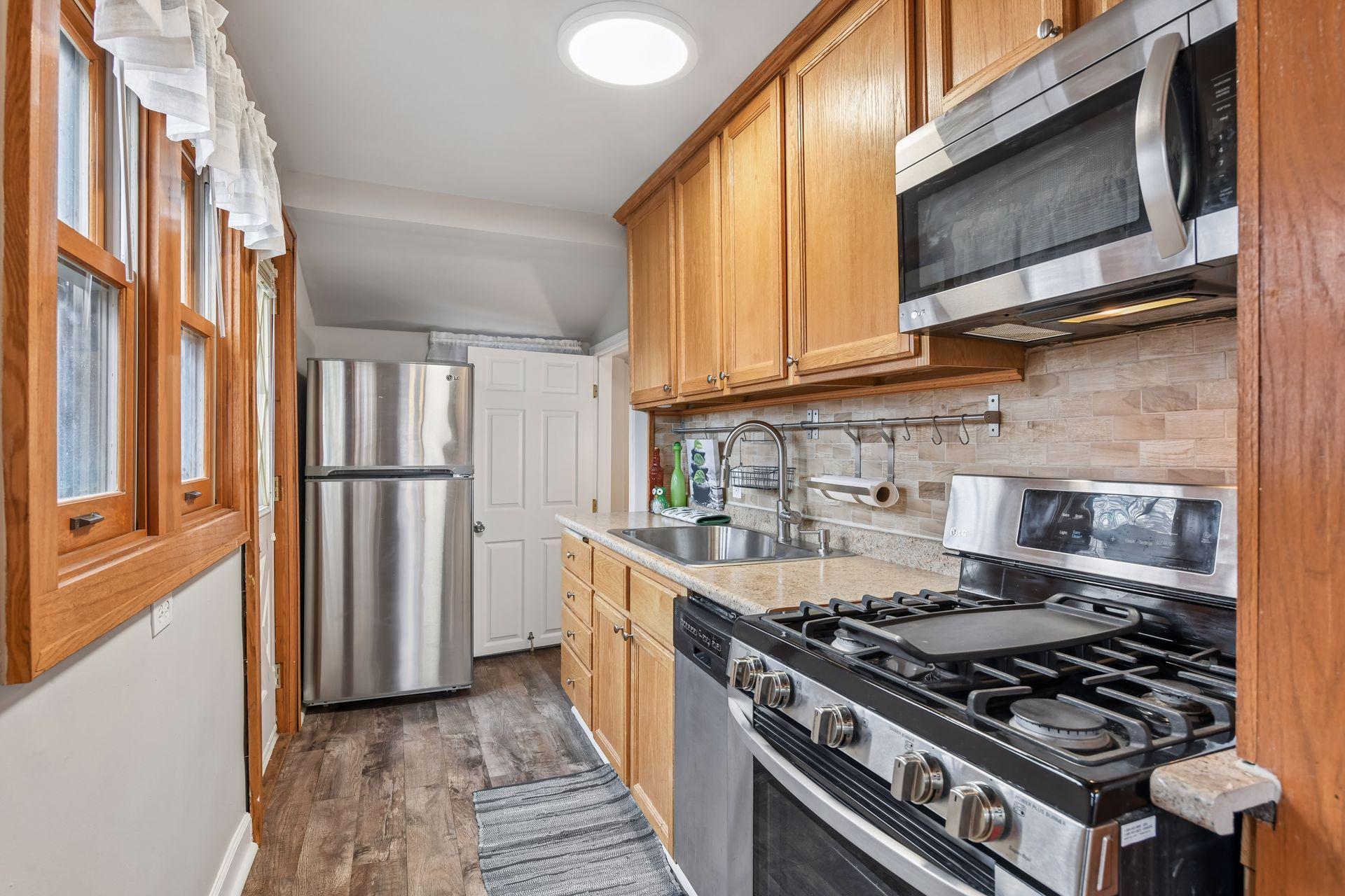 Well appointed kitchen with stainless appliances.