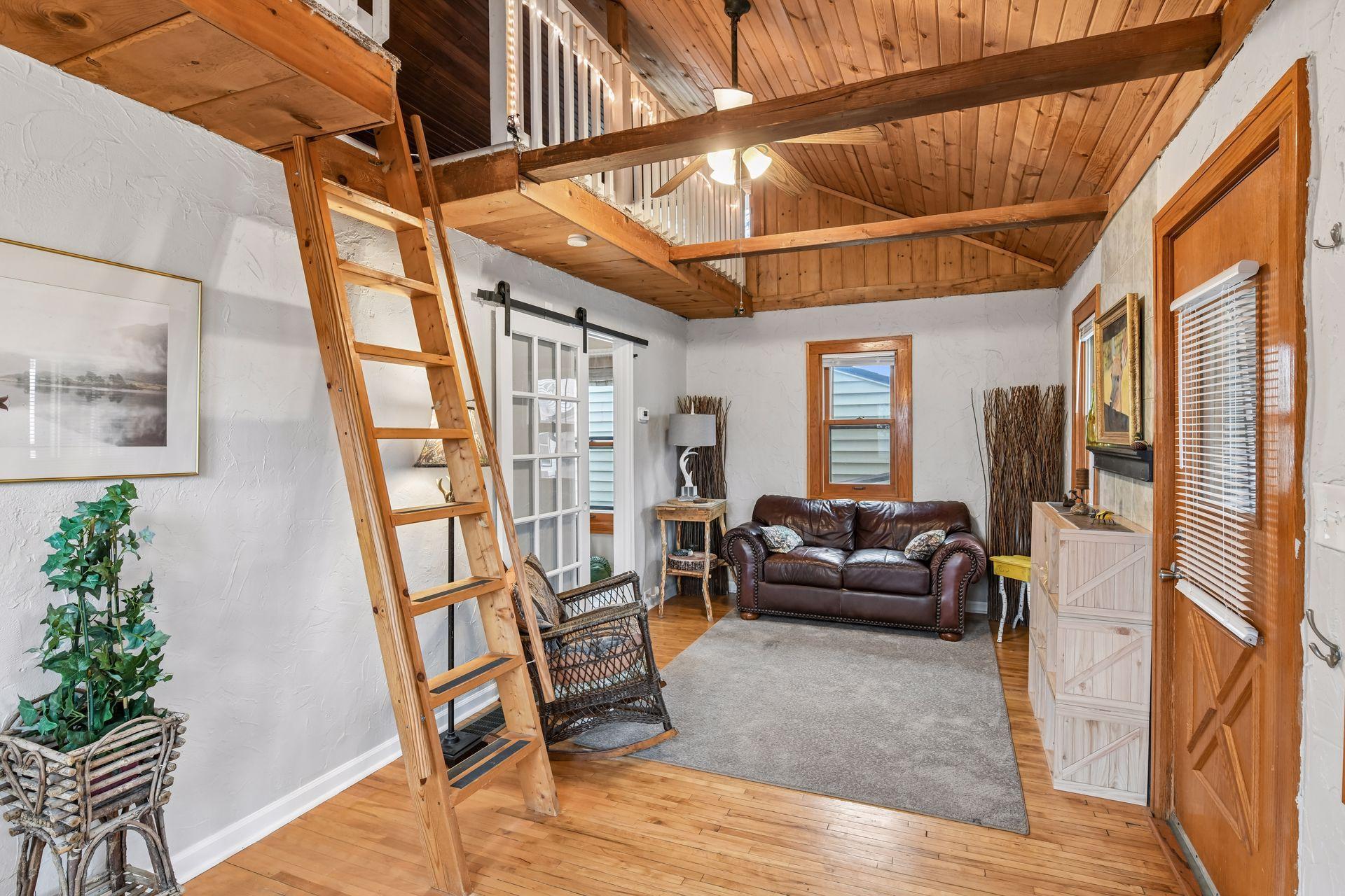 Bright living room with unique loft space.