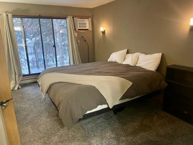 Primary bedroom with private, full bathroom and private balcony.