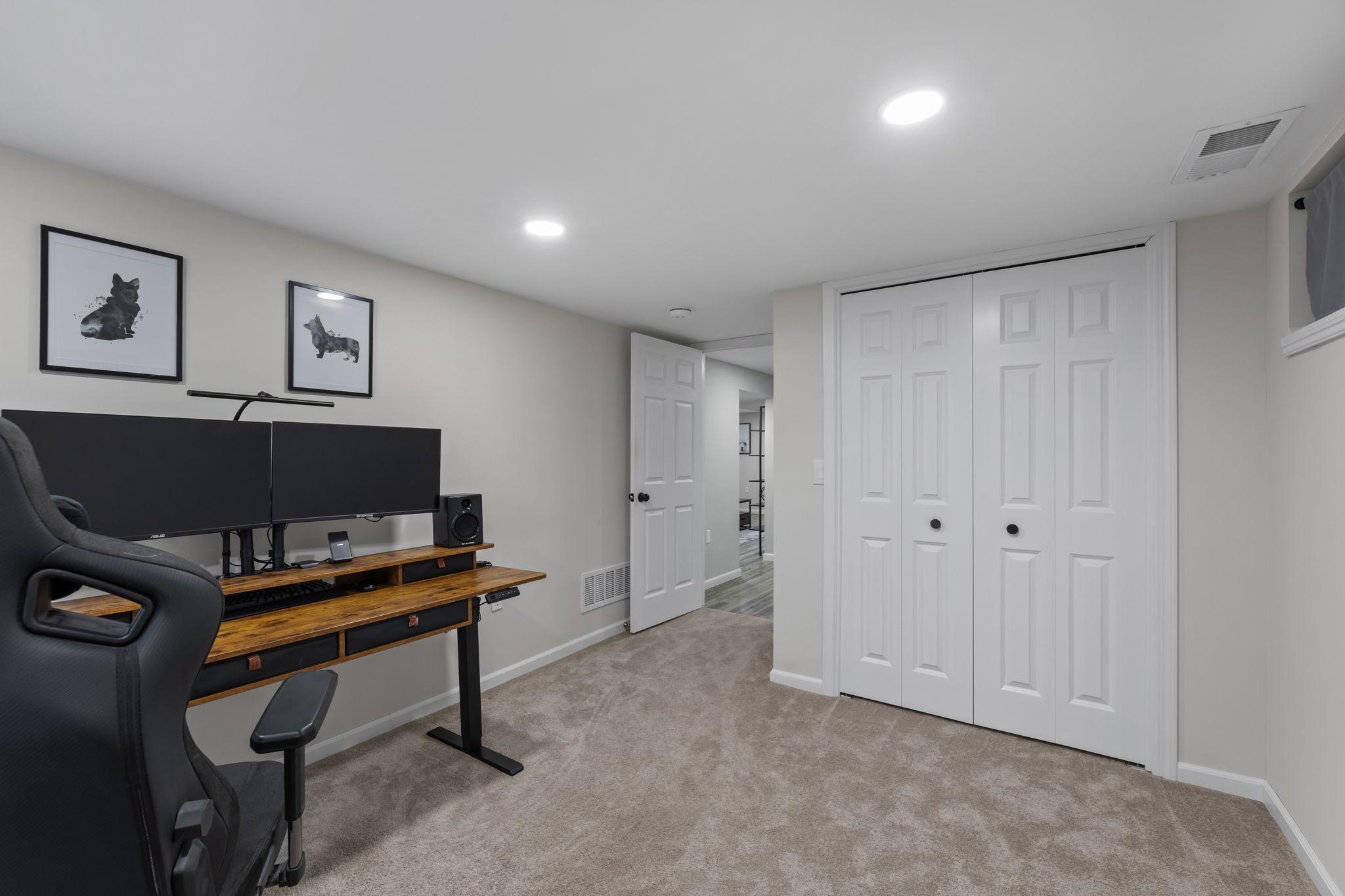 Lower-level third bedroom features a spacious closet with extra depth for added storage.