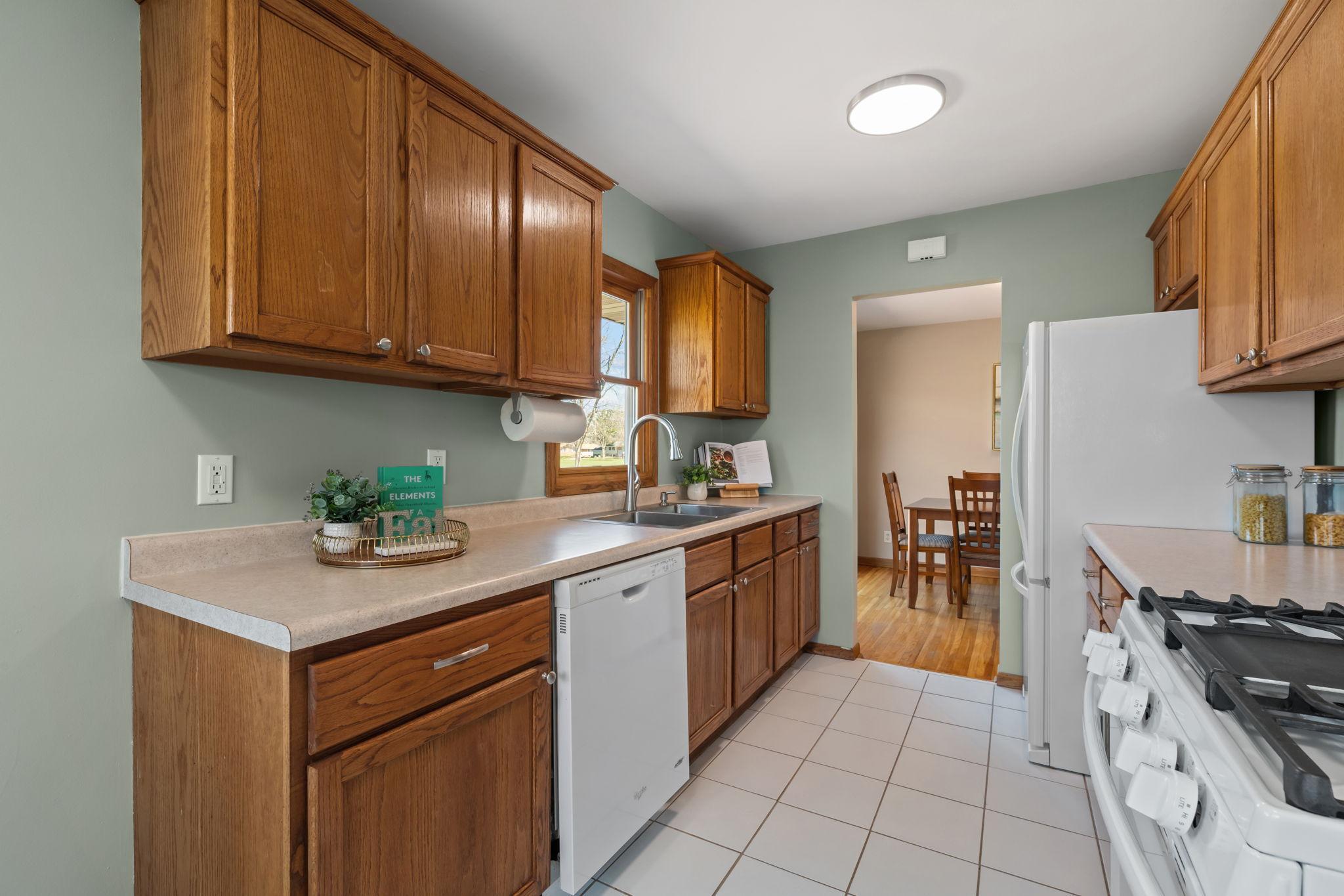 Conveniently located next to the dining room, the kitchen offers seamless access to the deck—perfect for summer BBQs and easy indoor-outdoor entertaining.