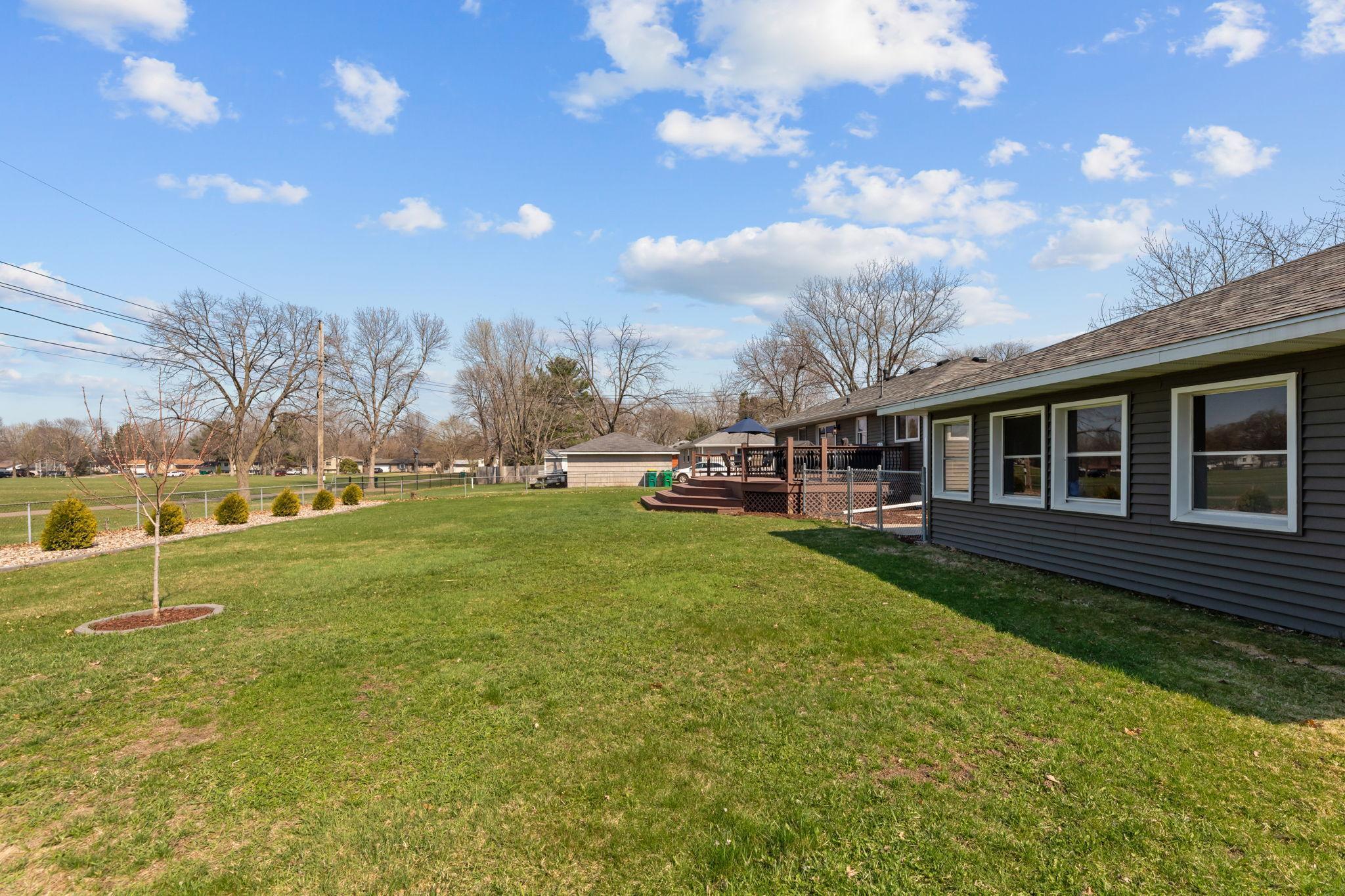 Located on a spacious .31-acre city lot, this home features a fully fenced backyard that backs to open park space, offering privacy and a rare natural backdrop within the city.