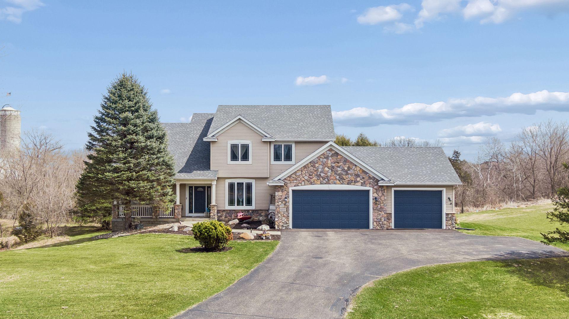 Beautiful 2+ acre setting in Denmark Township with a private, wooded backdrop and natural ravines on both sides.