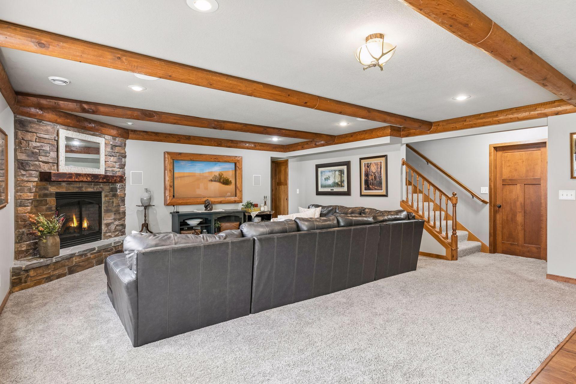 Walkout lower level Family Room with second gas fireplace and plenty of space to gather.