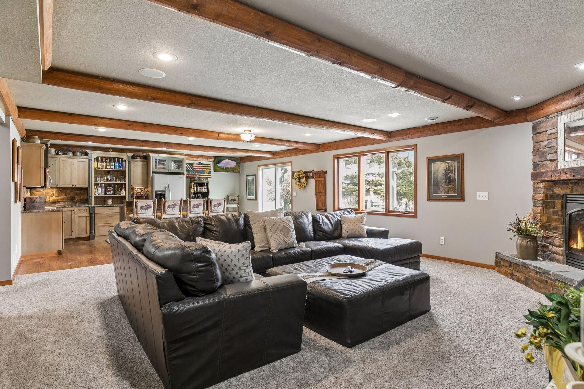 Large lower level Family Room with space for multiple seating areas and direct access to the backyard.