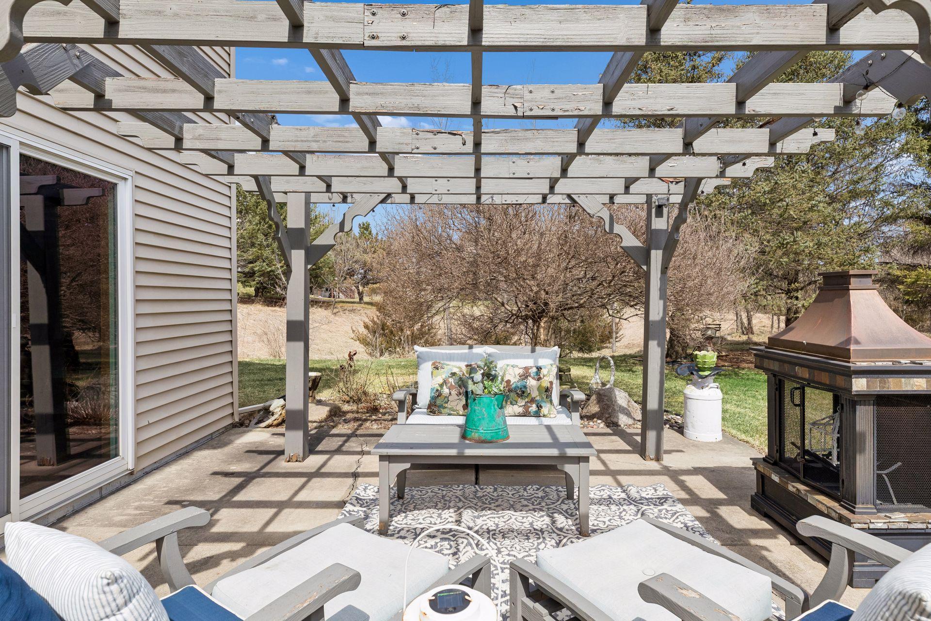 Walkout patio with Pergola - great setup for outdoor seating, lighting, and relaxing.