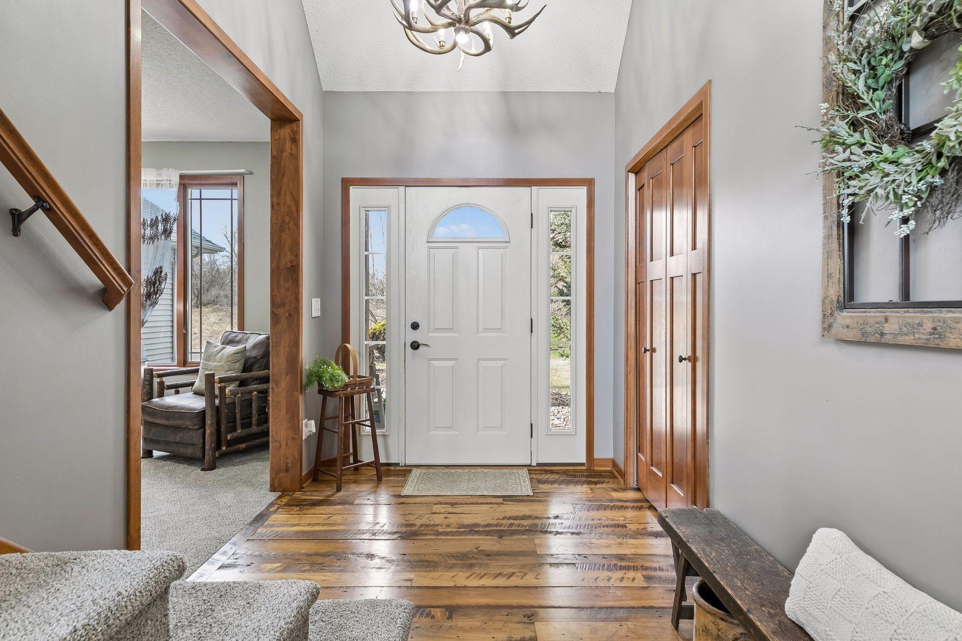 Spacious entry with reclaimed hardwood floors and a nice first impression as you walk in.