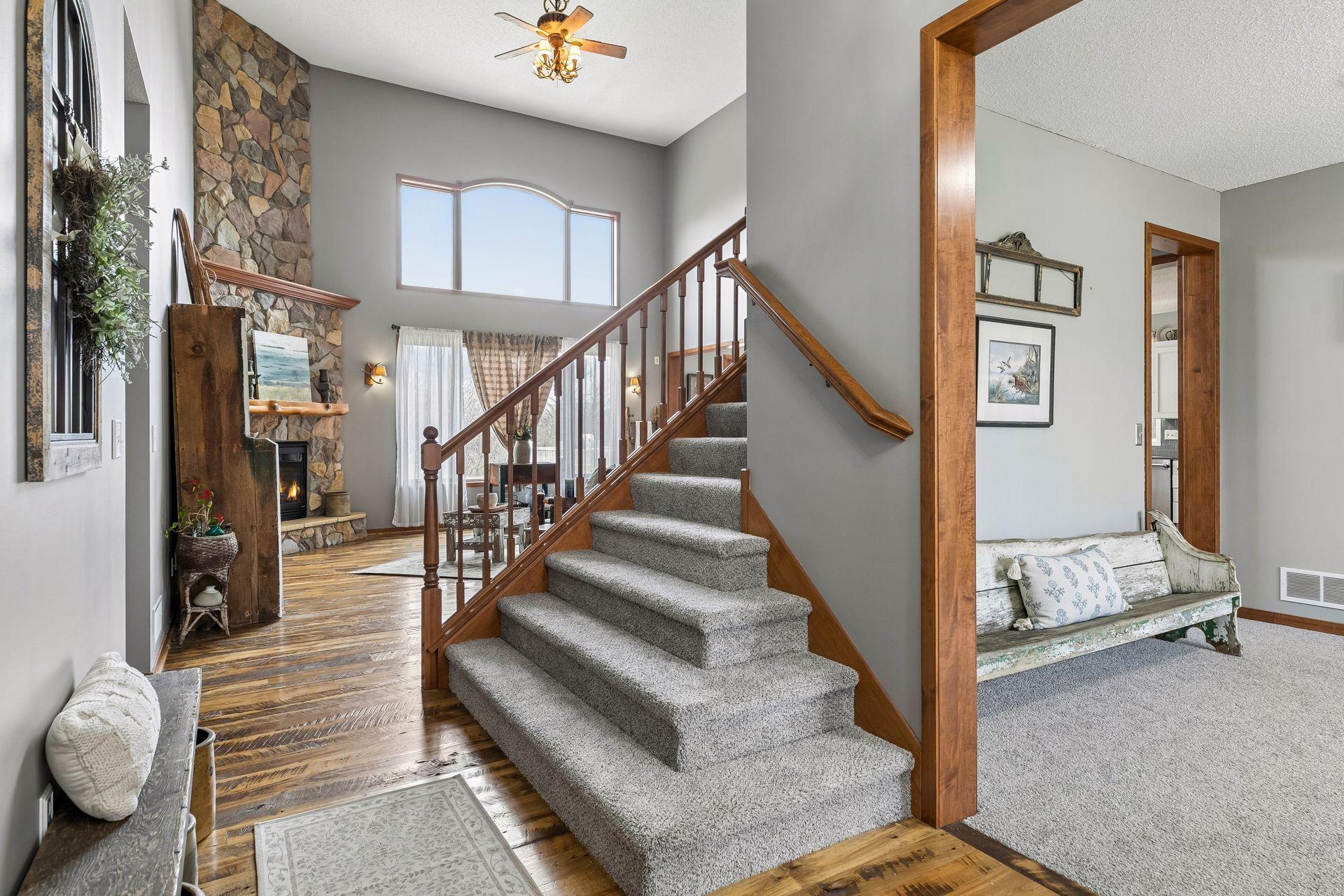 Open entry leading into the two-story vaulted Great Room with views straight through to the backyard.