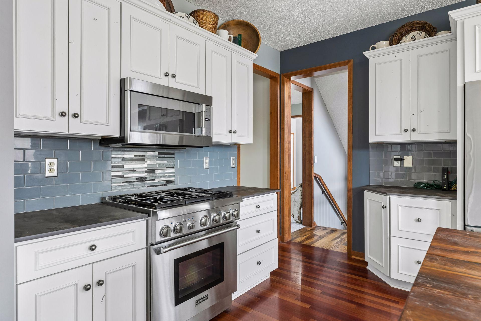 Well-designed cooking area with storage and prep space nearby.