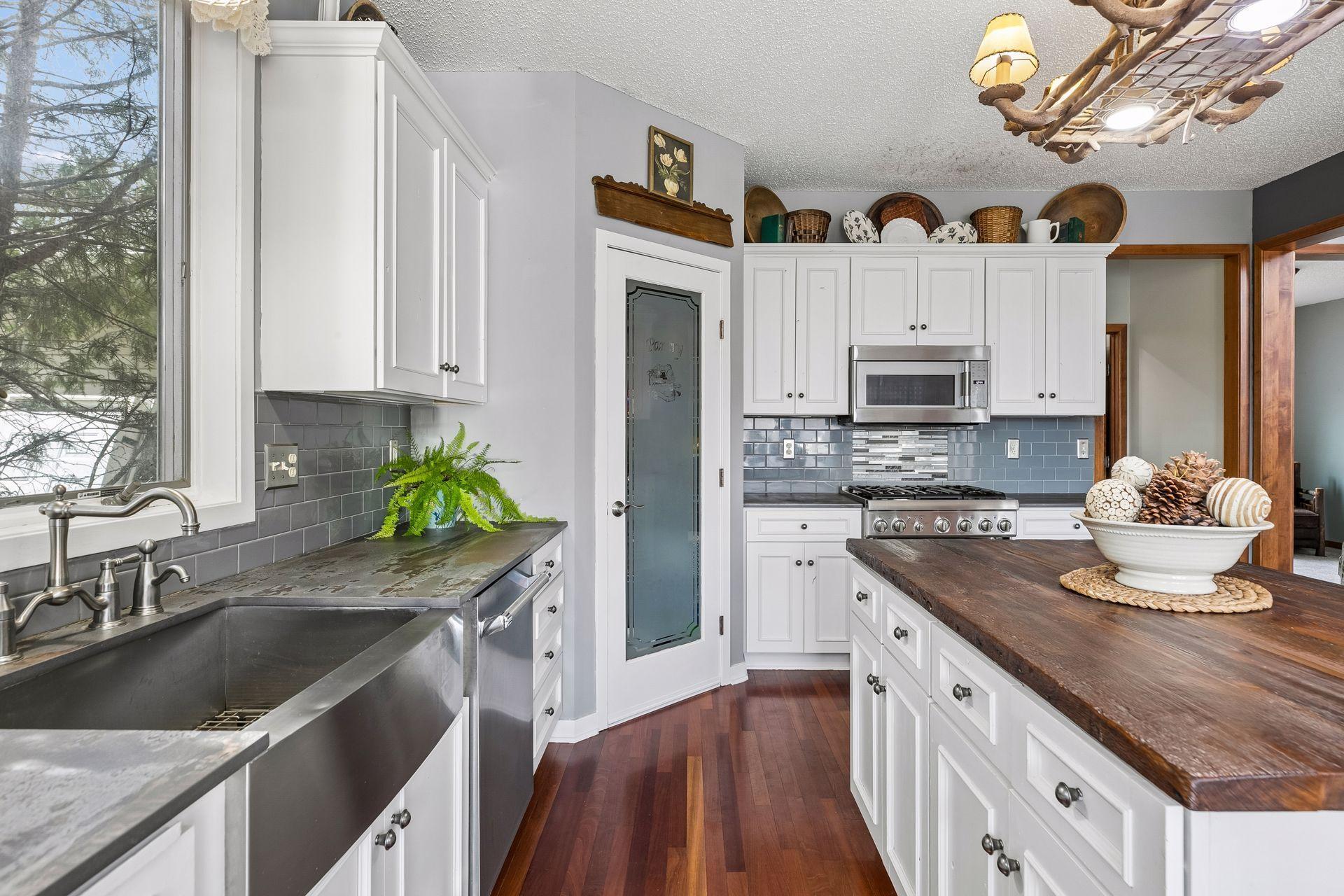 Pantry with etched glass door and added storage.