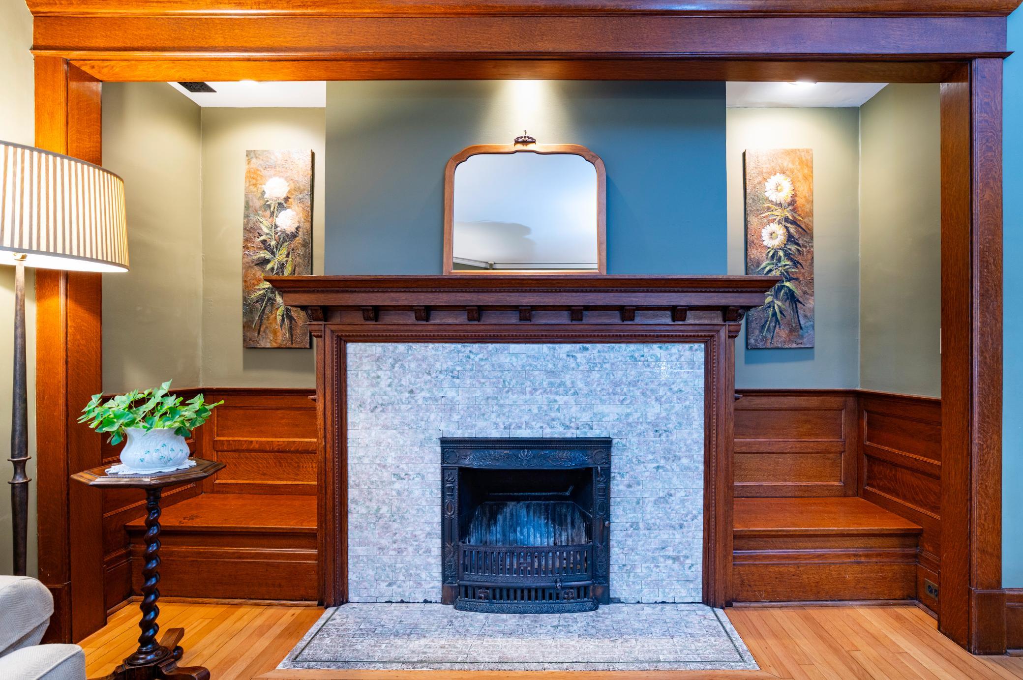 The fireplace cove was designed with built-in benches to add seating and function to the living room.
