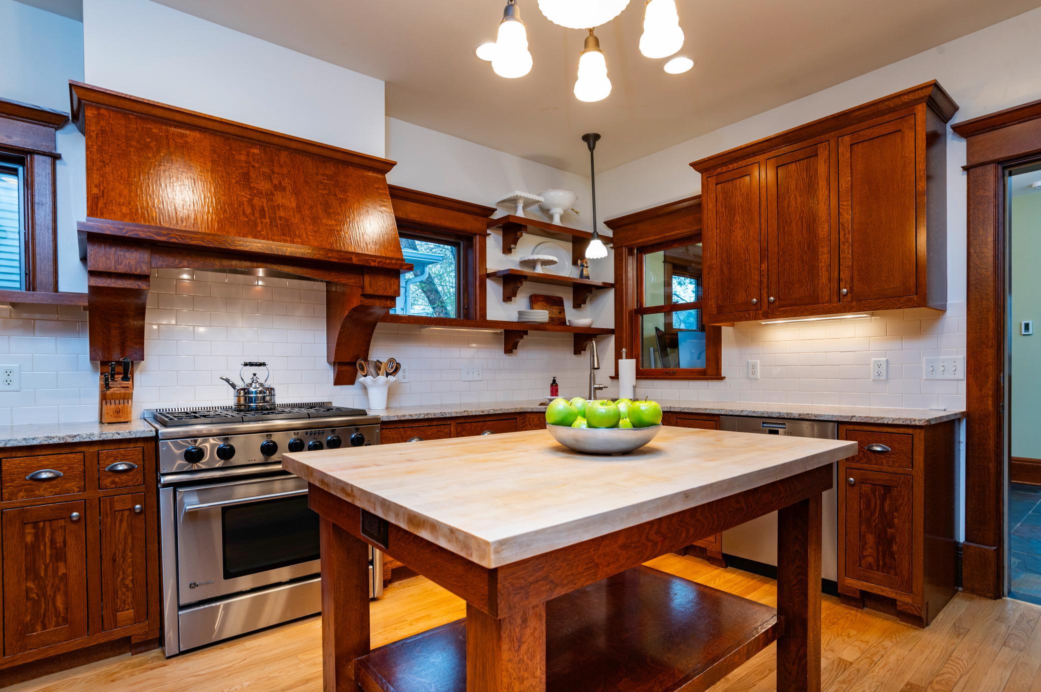 The custom kitchen was thoughtfully designed to match the home's original charm and beauty.