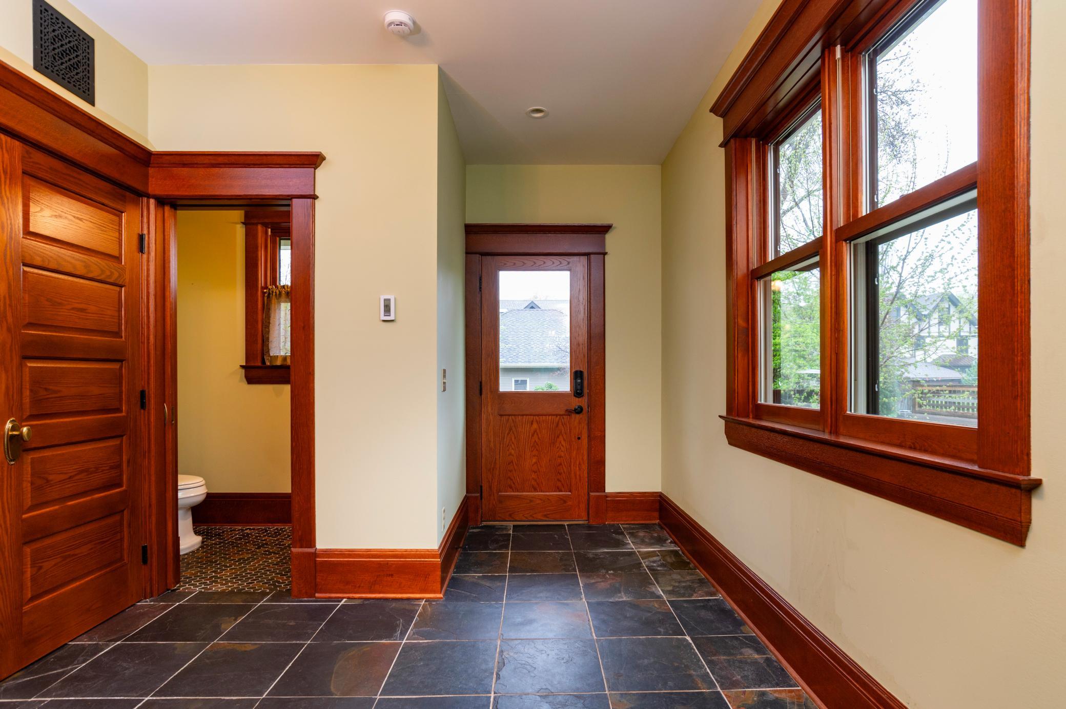 This room also provides ample space for mudroom benches and hooks!