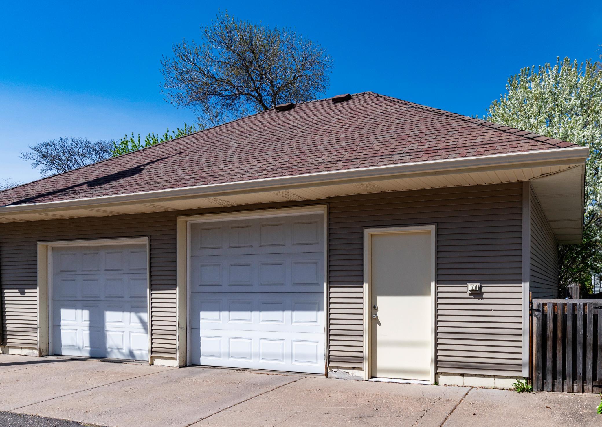 The heated and finished garage has two full stalls, one with an oversized garage door and tons of room for additional storage.
