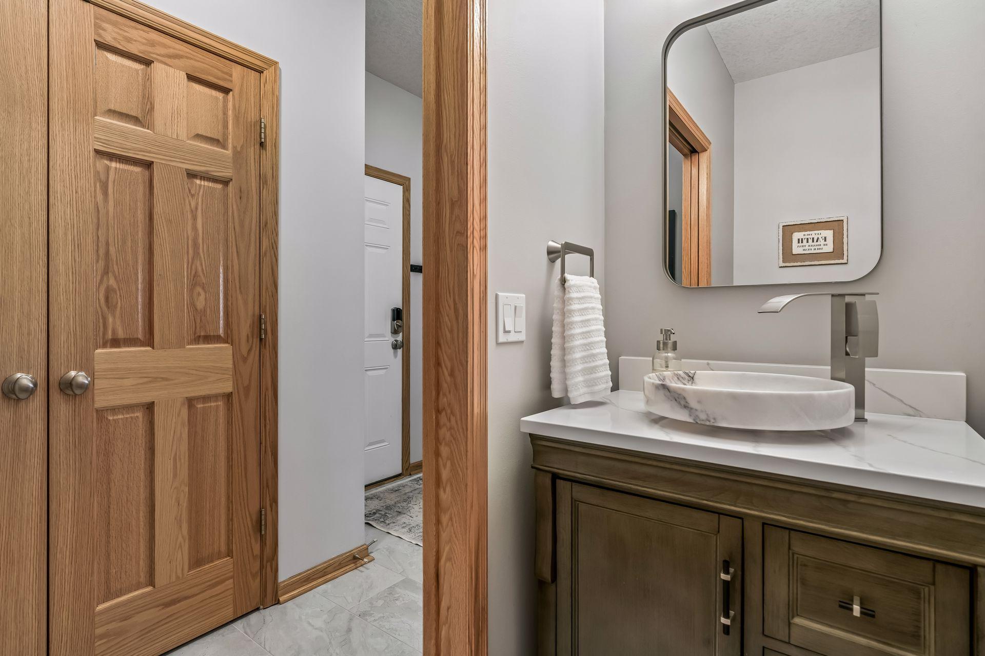 Perfect half bath just off the mud room coming in from the garage.