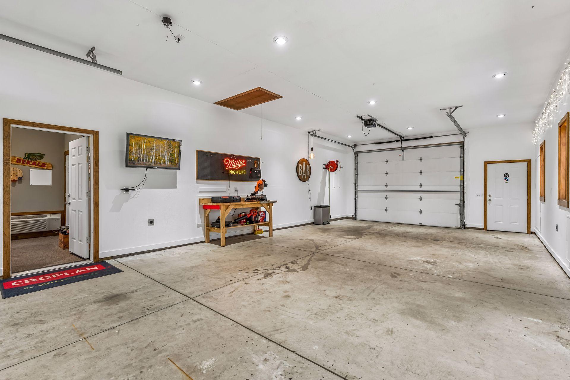 9' overhead door on one end and concrete floors.