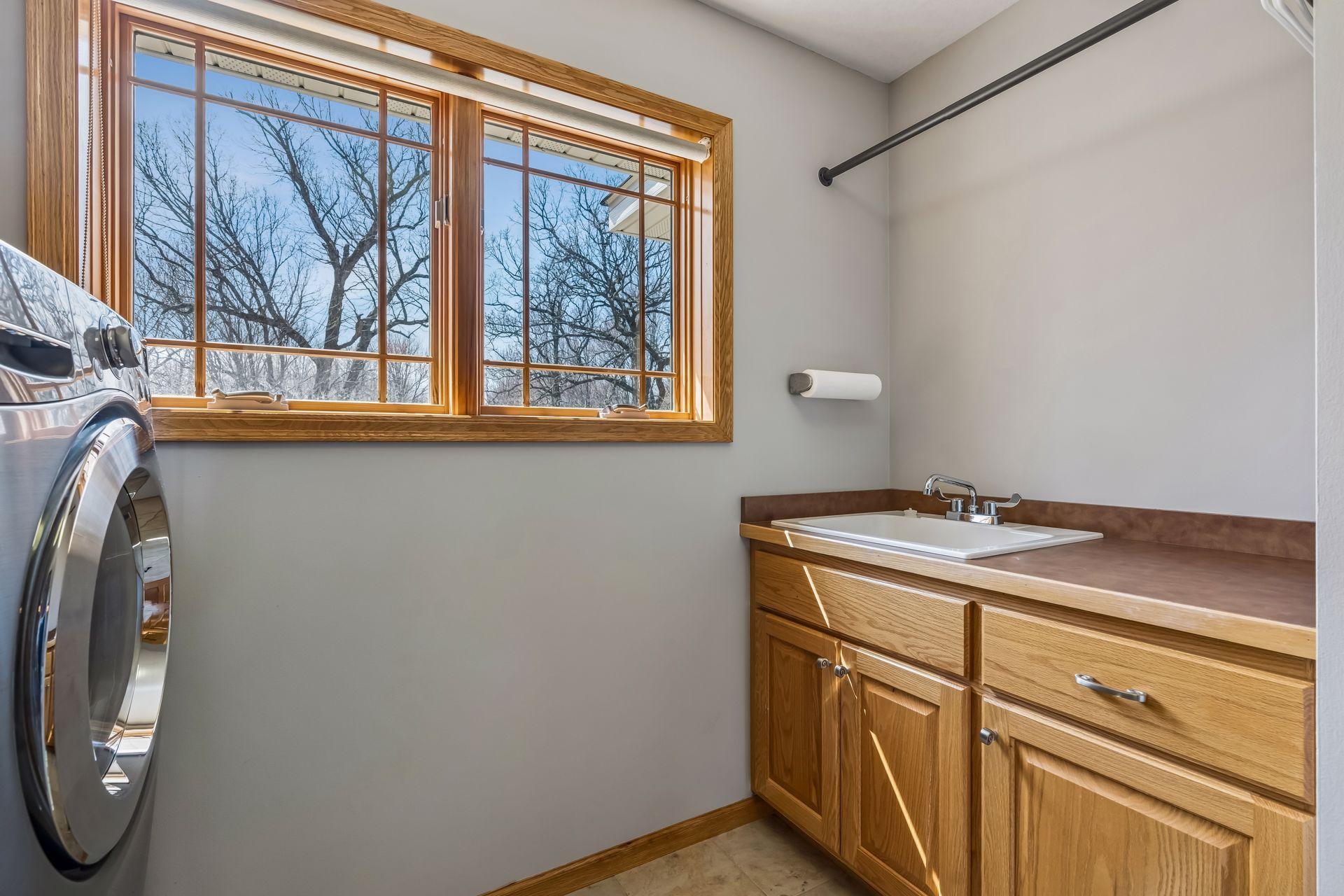 Includes a laundry sink and folding countertop.