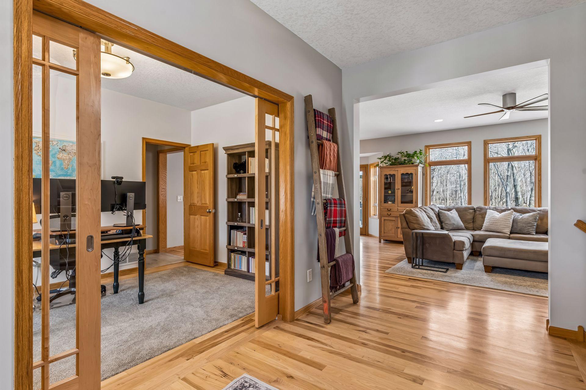 Main floor home office tucked away with pocket doors for privacy.