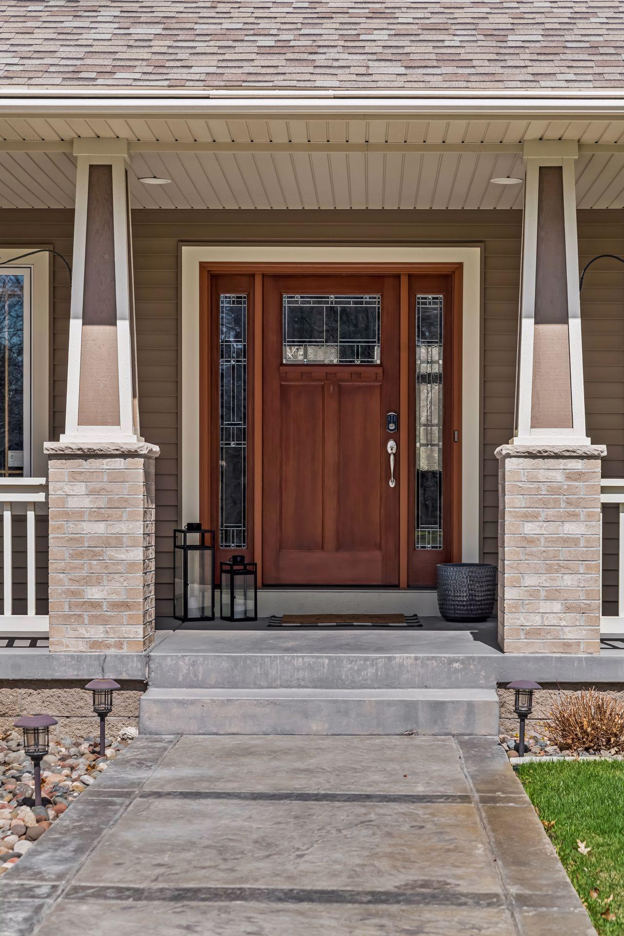 Inviting front entry with stamped concrete sidewalk.