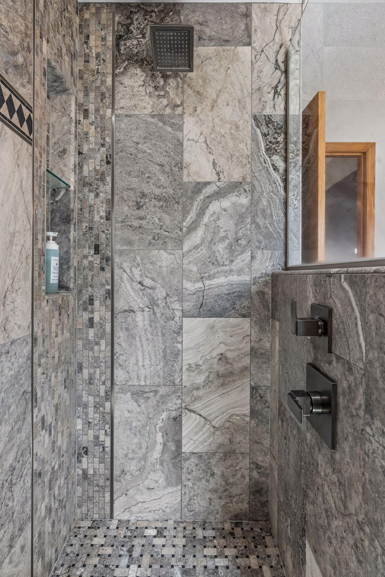 Beautiful custom tile in the rain shower.