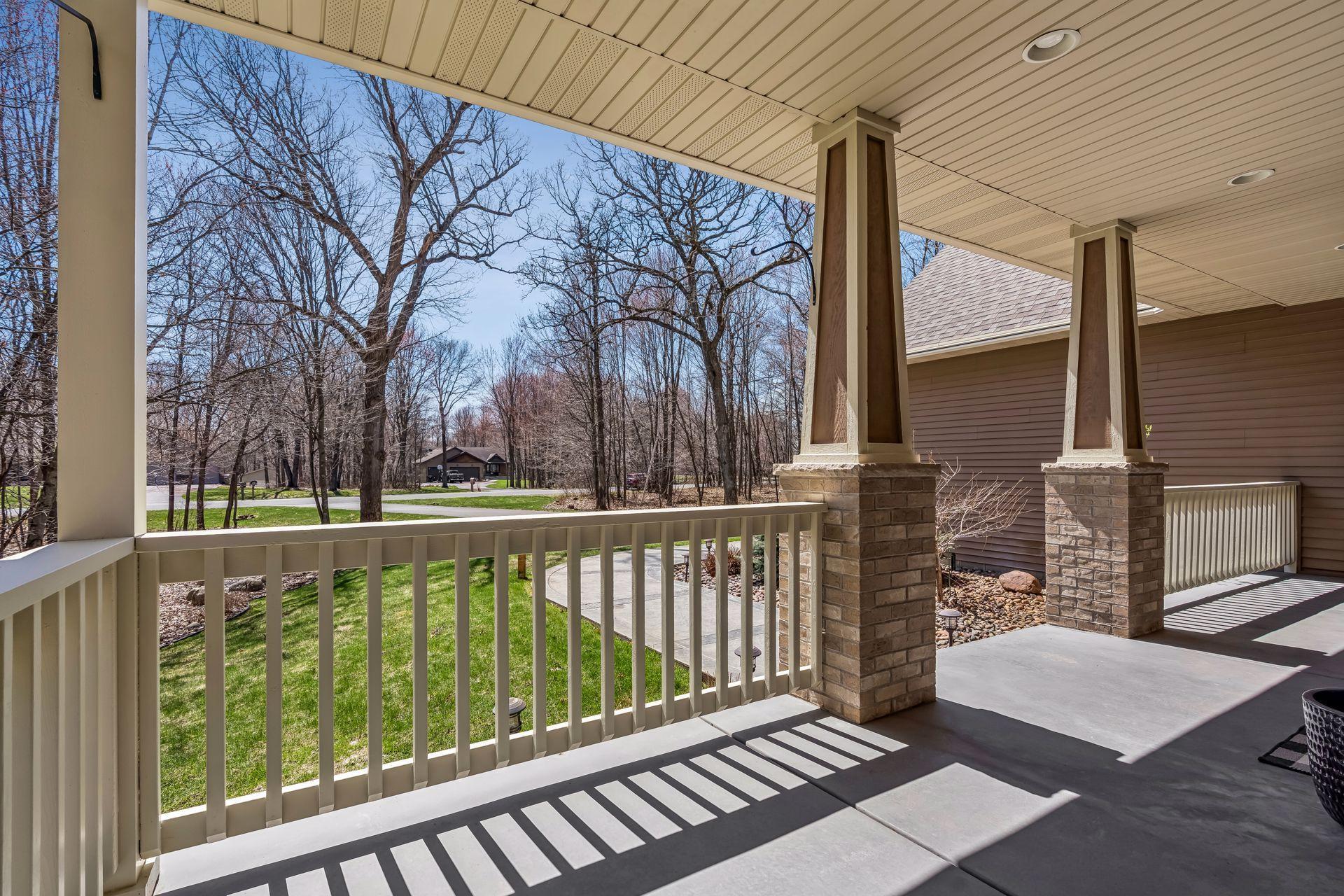 View of your front yard surrounded by trees.