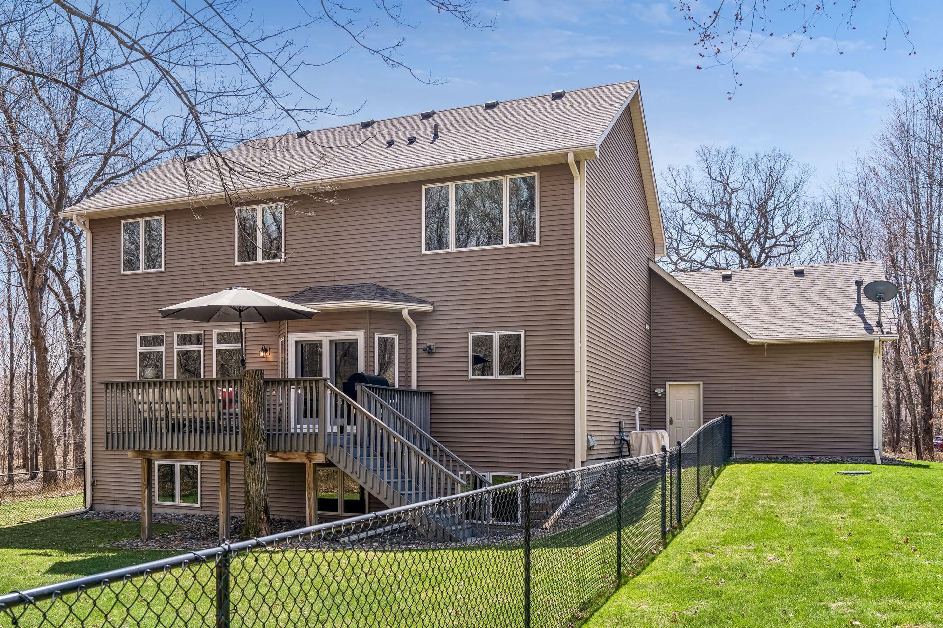 Black chain link fenced in backyard is perfect keeping pets.