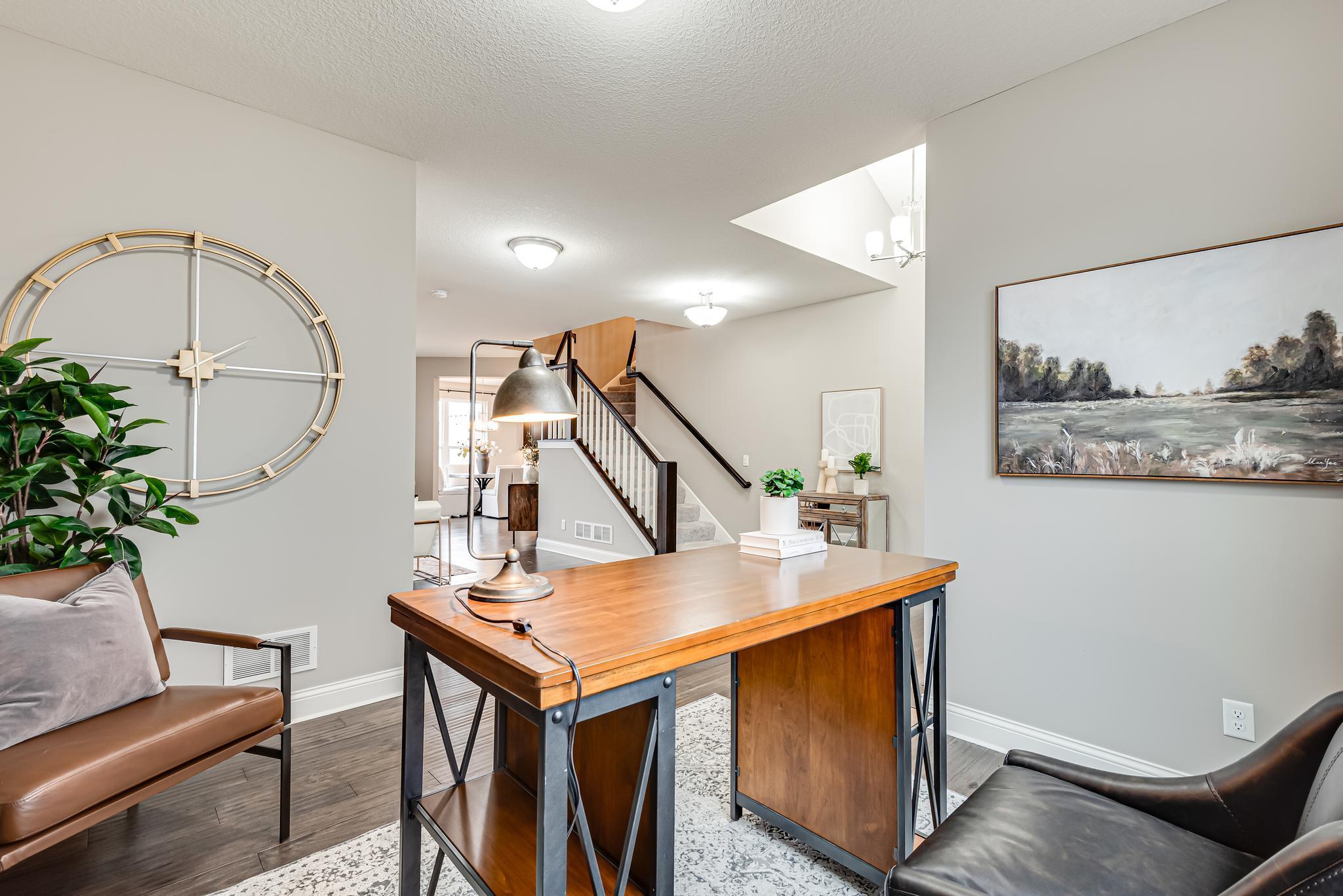 Currently staged as an office, could be a dining room, playroom, or homework area