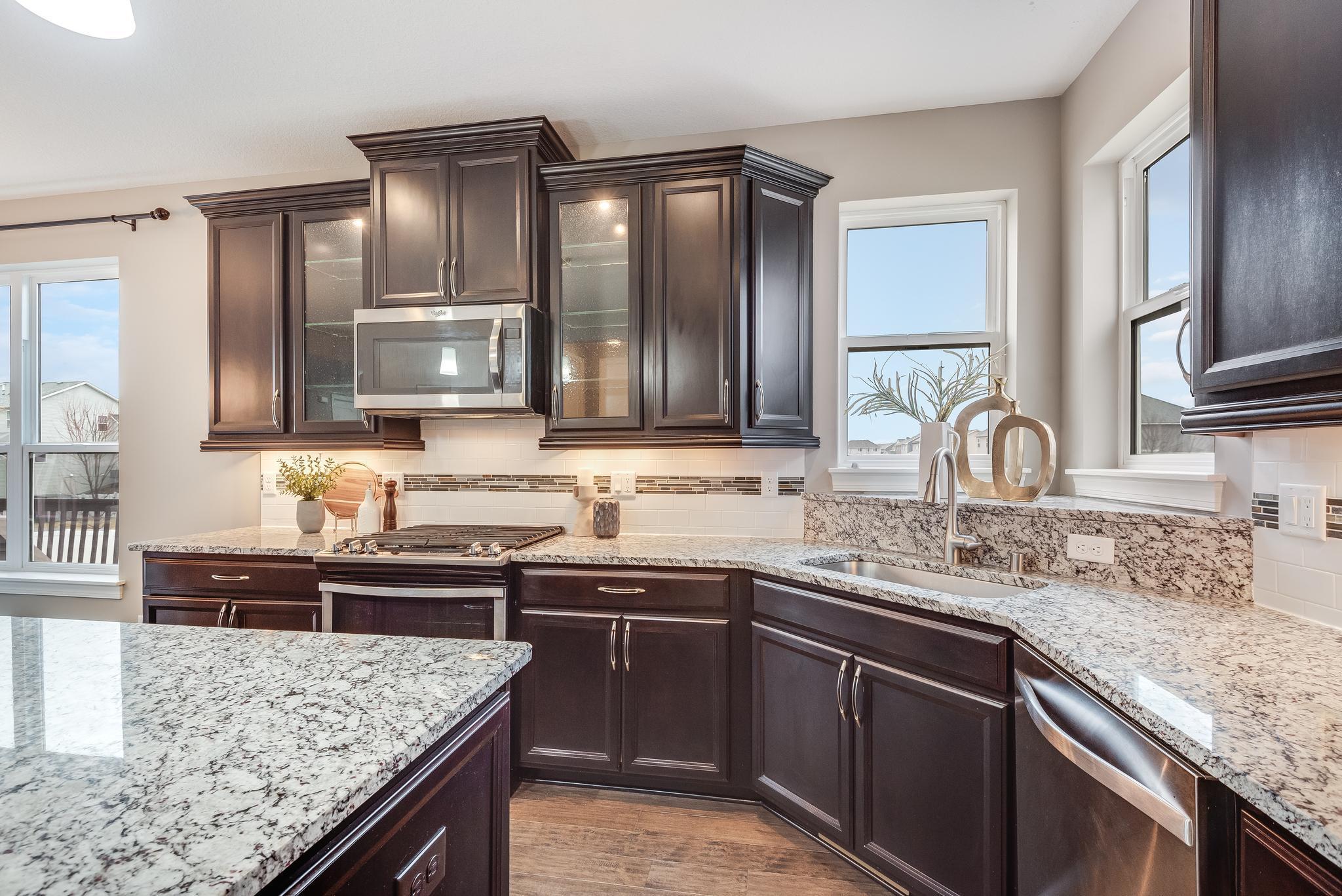 Glass-door, staggered height cabinets