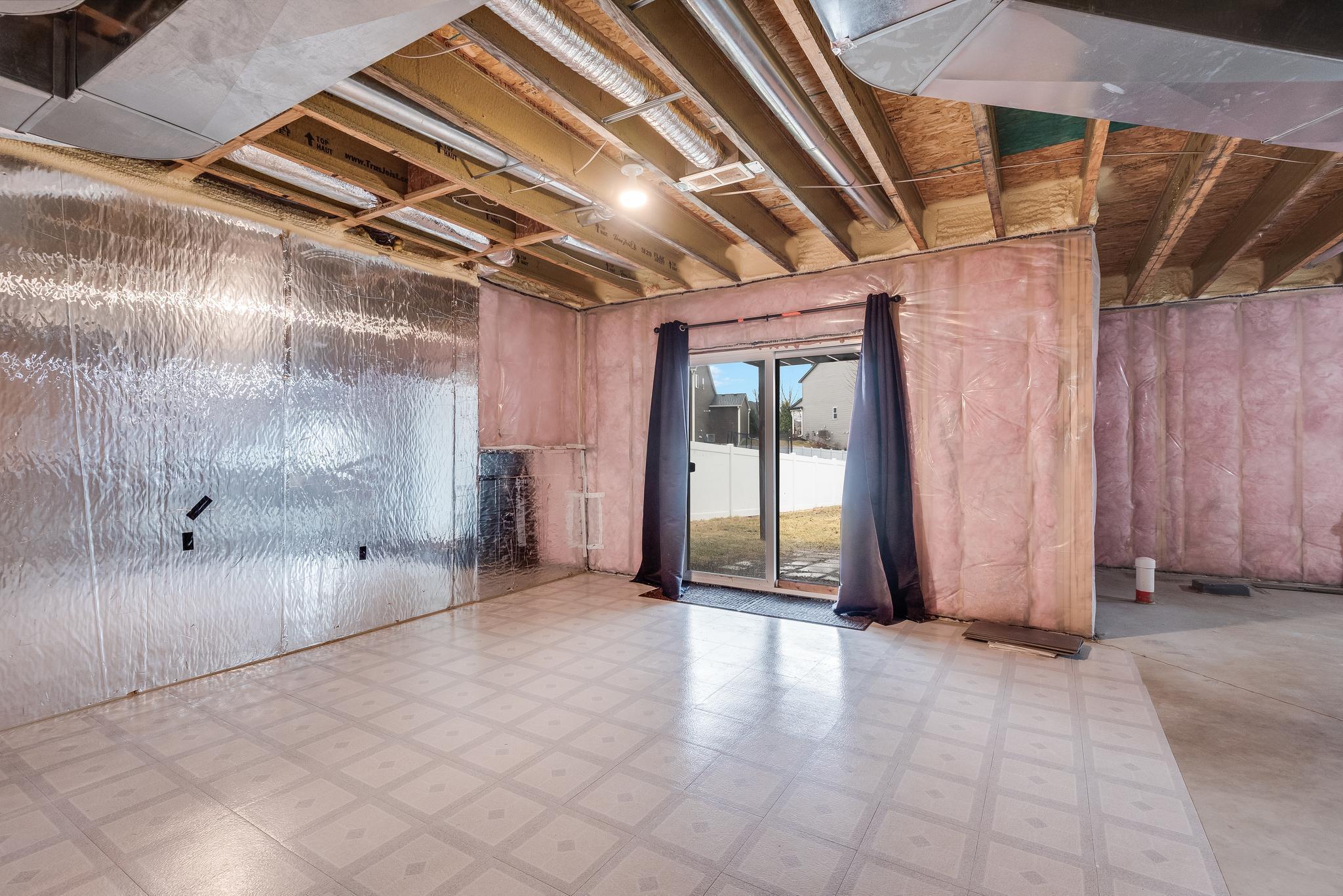 Basement walks out to patio area and large backyard