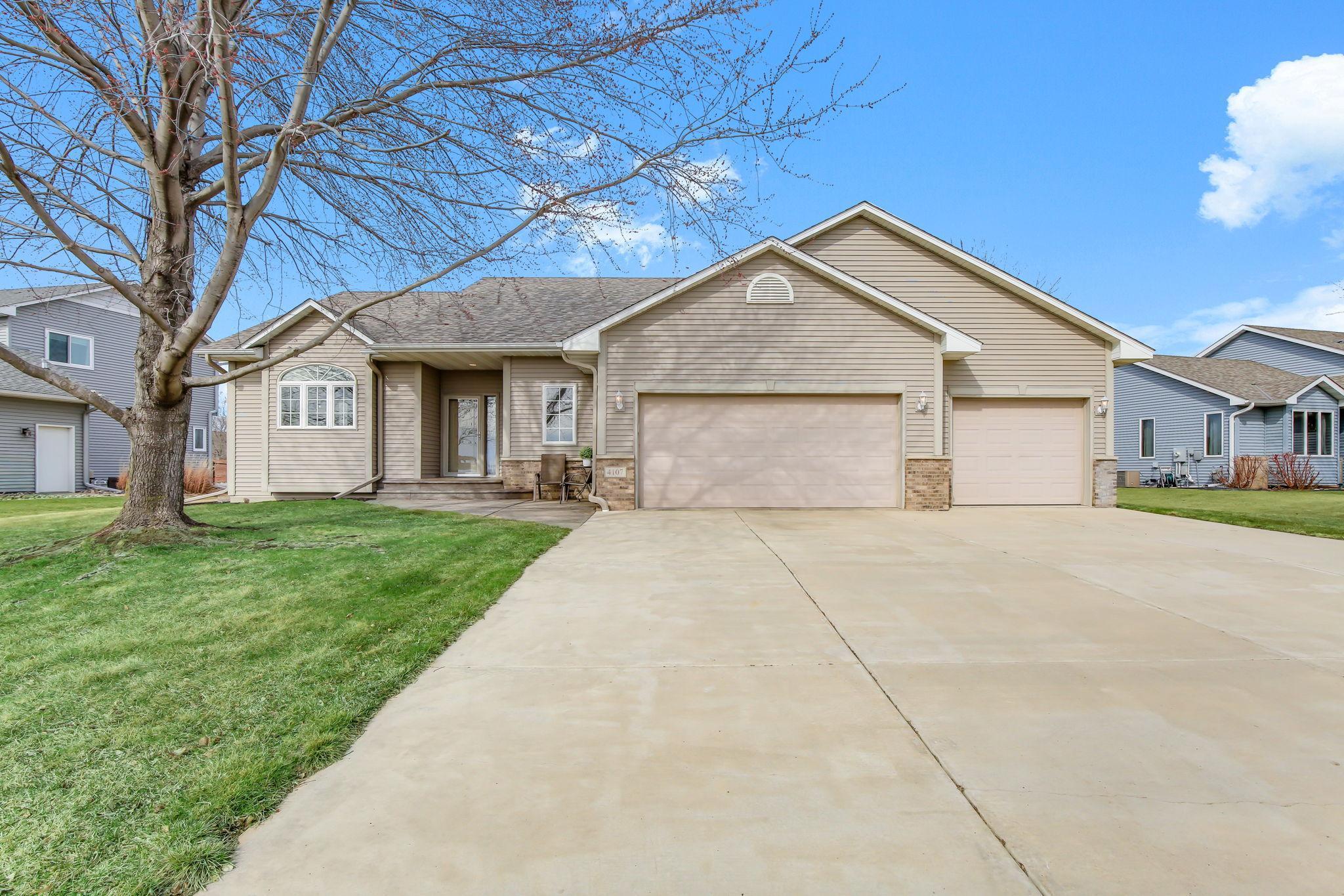Impeccably cared for 4 Bedroom, 4 Bath home with large concrete driveway and a 3-Car Garage!