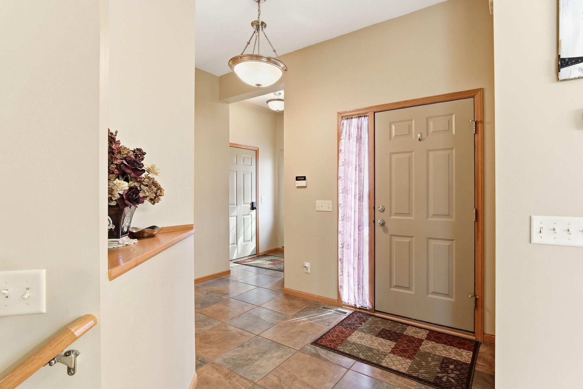 Large foyer leads to the back entrance as well. 1/2 bath off this entrance as well!